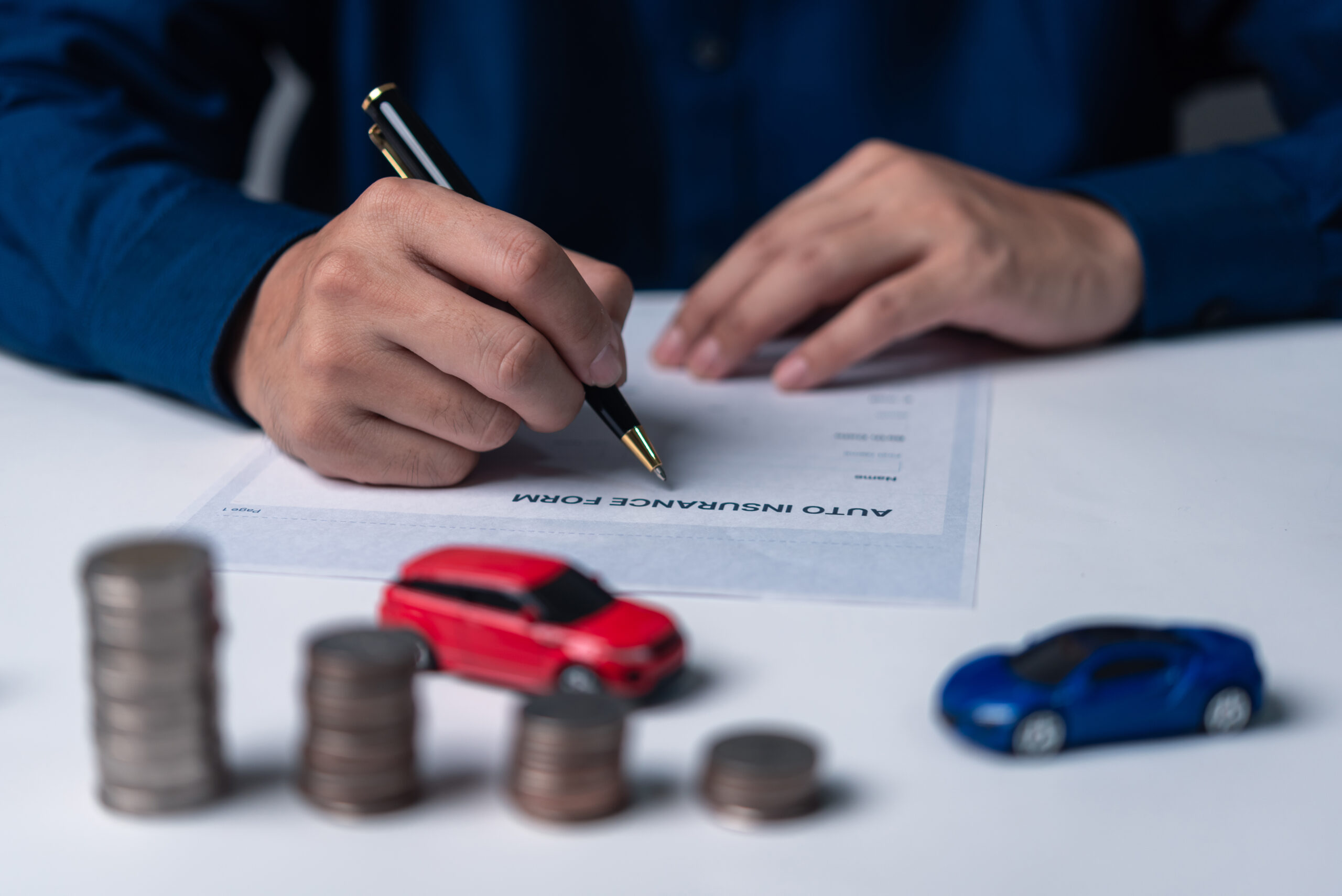 Home signing a car purchase or lease agreement. car loan and insurance concept.